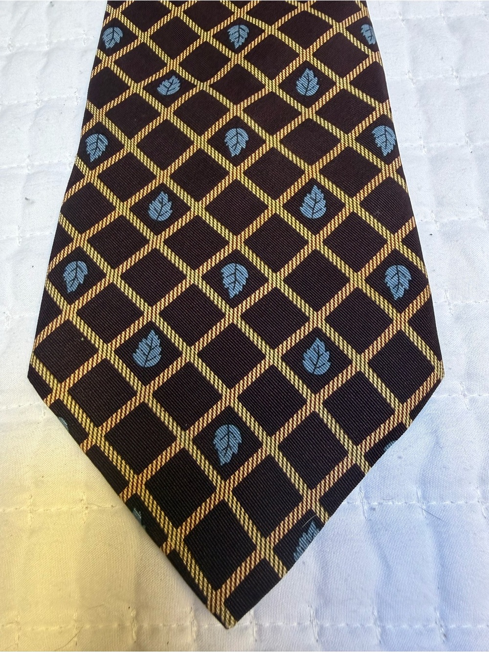 Tommy Hilfiger Classic Black and Gold Geometric Men's Tie with Blue Accents